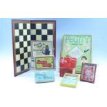 A quantity of early 20th Century board games and puzzles, including "The Queen Mary Puzzle" and "The