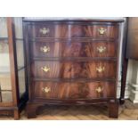 A reproduction Georgian serpentine fronted mahogany chest of drawers, in flame figured mahogany,