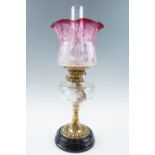 A Victorian oil lamp, having an Art Nouveau influenced etched achromatizing glass shade, a star-