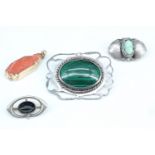 Three vintage brooches and a pendant, variously comprising mounted malachite, jade and coral