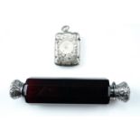 A Victorian white metal mounted ruby glass double scent / smelling salts bottle, together with an