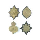 Four various Guards other ranks' pouch / valise badges