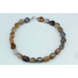 A necklace of heavy faceted polyhedral agate beads, beads approx 17 mm x 13 mm, 45 cm