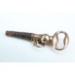 An early 19th Century watch key, having a yellow metal bow terminal and ratchet mechanism, 28 mm