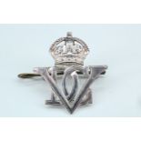 A pre- 1953 5th Dragoon Guards officer's white metal cap badge, stamped "silver"