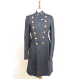 An early 20th Century Green Howards officer's blue patrol tunic, its label bearing the inscribed