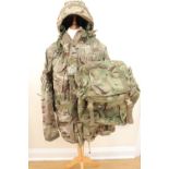 A group of current British army combat camouflaged and other clothing, a helmet and cover,
