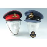 A late 20th Century RAF officer's peaked cap, in original carton, together with an RAF cap badge and