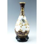A late 19th Century Aesthetic period enamelled glass vase, of slender-necked baluster form, finely