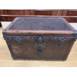 A late 19th / early 20th Century French travel trunk by Bigot of Paris, constructed from wood with a