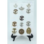 A group of 13th / 40th Regiments of Foot and Somerset Light Infantry cap badges