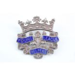 A 1911 enamelled silver Young Helpers' League badge. [The Young Helpers' League was founded by Dr