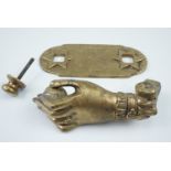 A late 20th Century cast brass door knocker in the form of a hand, backplate 9 x 7.5 cm
