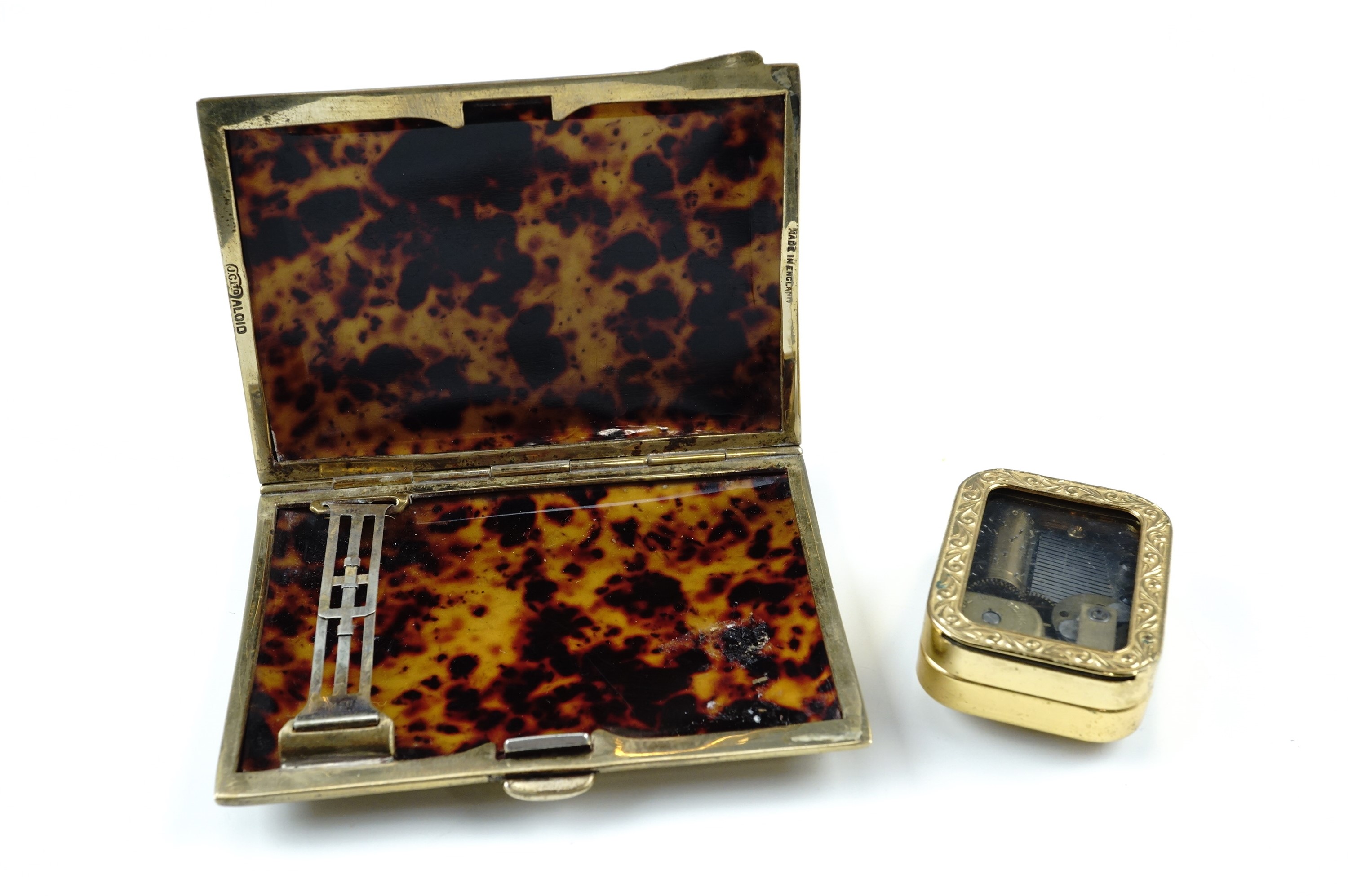 A vintage gilt metal cigarette case by Joseph Gloster of Birmingham and branded "Aloid", of