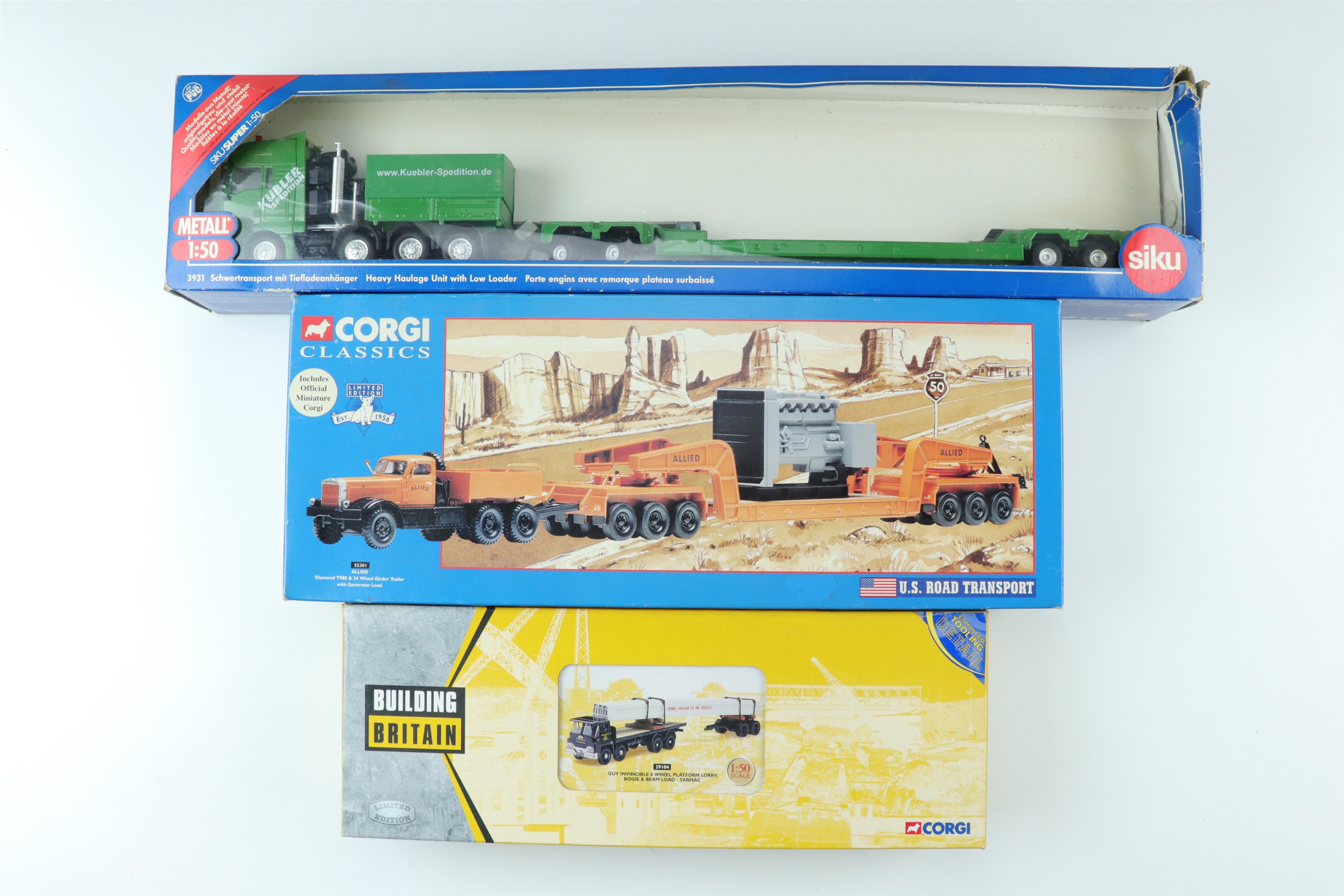 A boxed Corgi Classics US Transport die-cast low loader with generator, a Guy Invincible 8 wheel,
