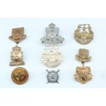 A group of South African and Australian cap badges etc