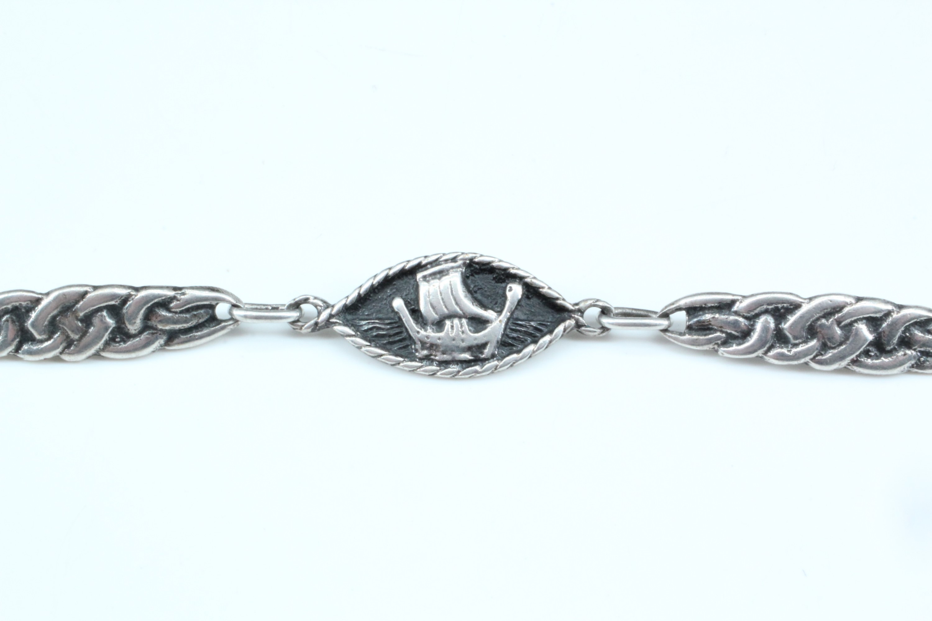 A Scottish Iona white metal bracelet, of Celtic interlace decorated links dividing lenticular - Image 3 of 4
