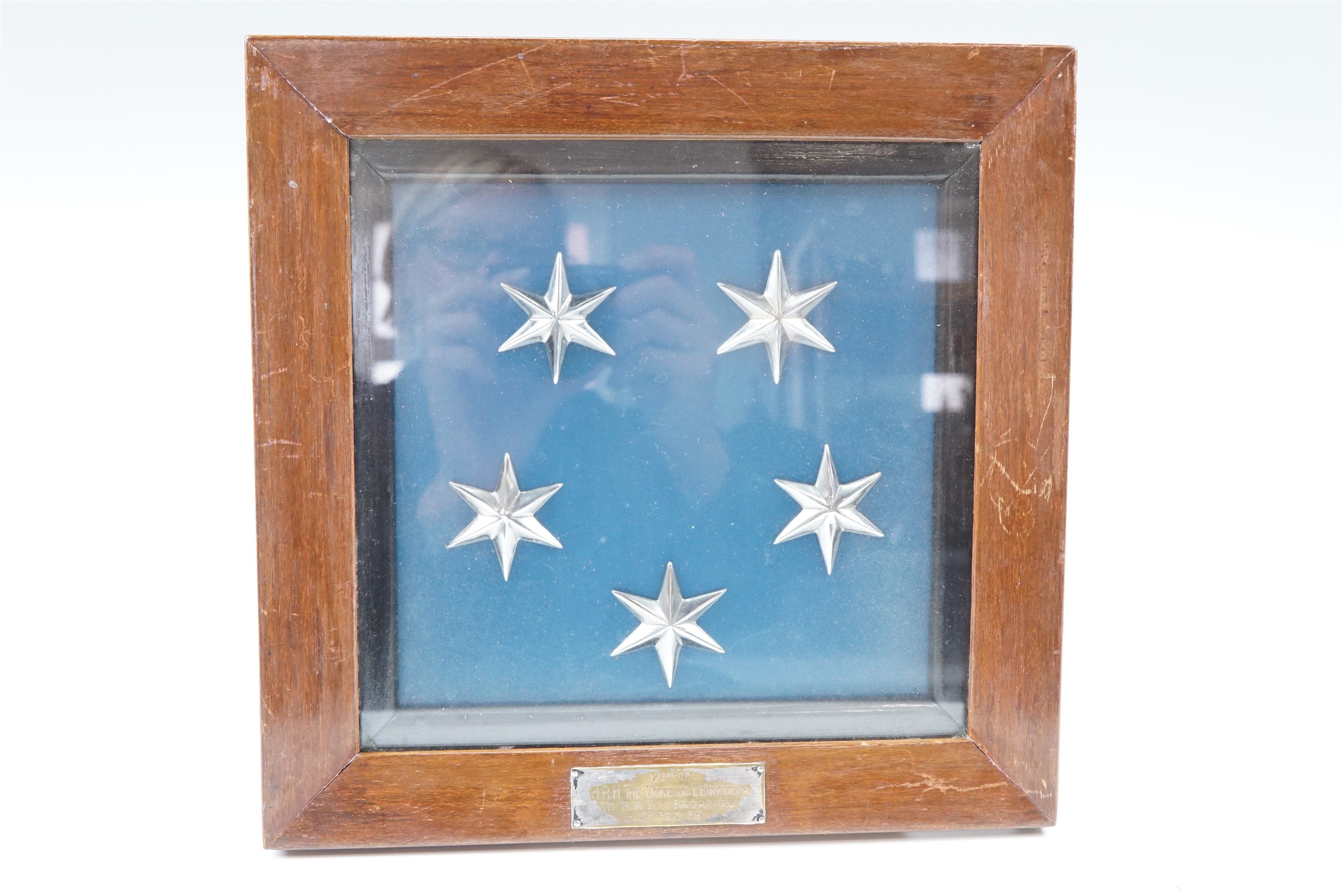 A framed display of five metallic Singapore flag stars bearing a plaque engraved "Visit of HRH The - Image 2 of 2