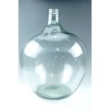 A very large clear glass carboy, 40 cm x 55 cm