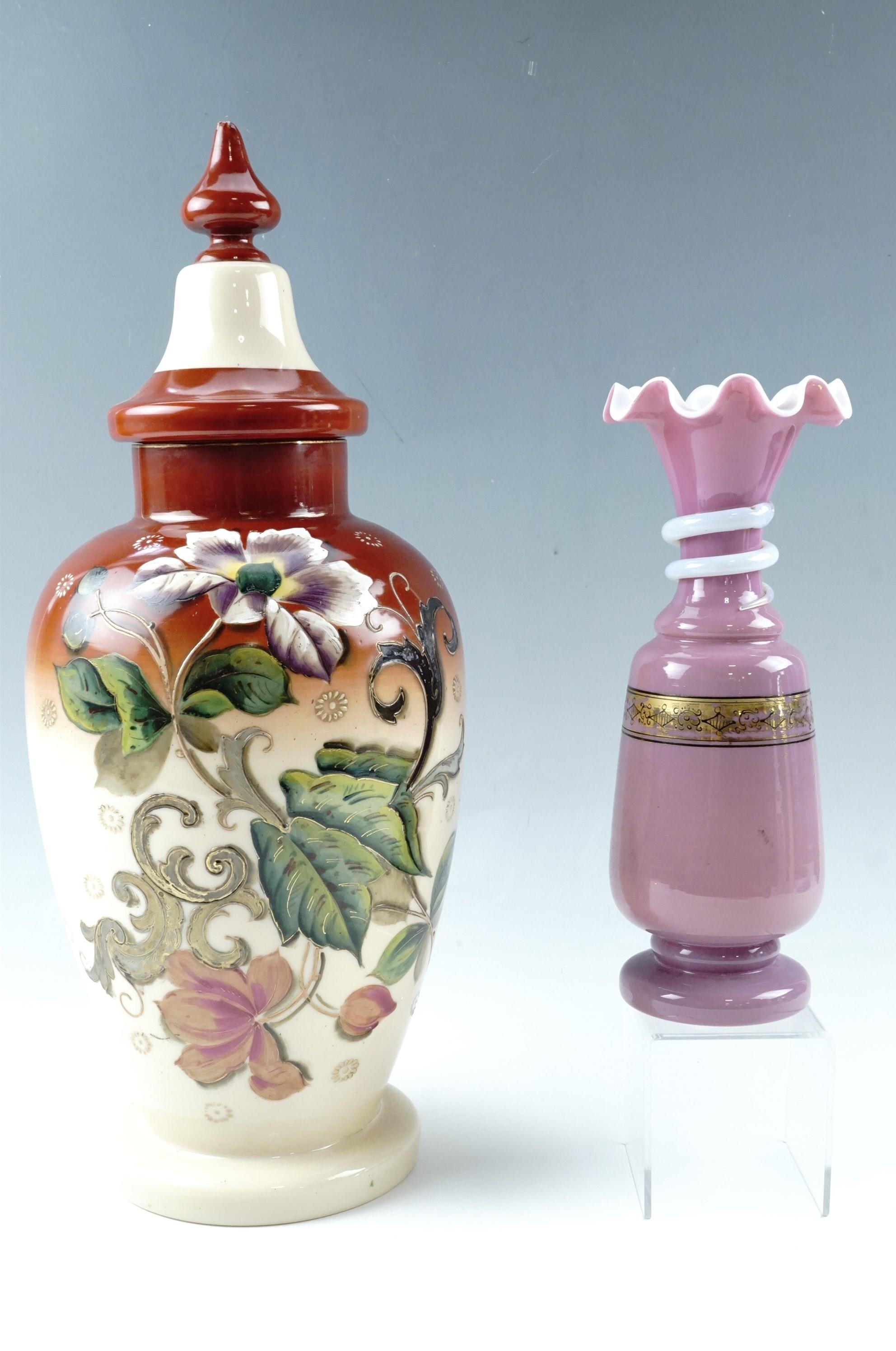 A Victorian large enamelled glass covered vase together with one other Victorian glass vase, tallest