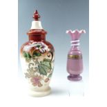 A Victorian large enamelled glass covered vase together with one other Victorian glass vase, tallest