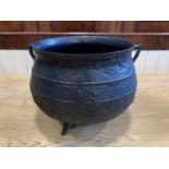 A medium cast iron cauldron 37 cm x 33 cm