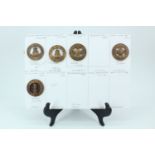 Four various Home Service pattern helmet plate centres