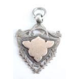 A late Victorian silver shield-shaped watch chain fob, 35 mm x 27 mm