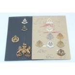 A group of Military Police cap badges