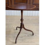 A reproduction Georgian cross-banded mahogany oval tripod wine table, 42 cm x 32 cm x 57 cm