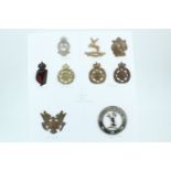 A group of Home Guard cap badges