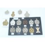 A group of 25th of Foot and King's Own Scottish Borderers and related cap badges