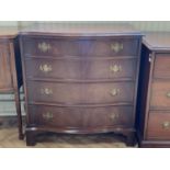 A reproduction Georgian mahogany serpentine-fronted chest of drawers, having brass bale handles