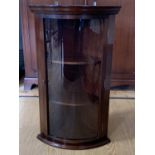 A small reproduction Georgian glazed and bow fronted mahogany corner cabinet, 86 cm high