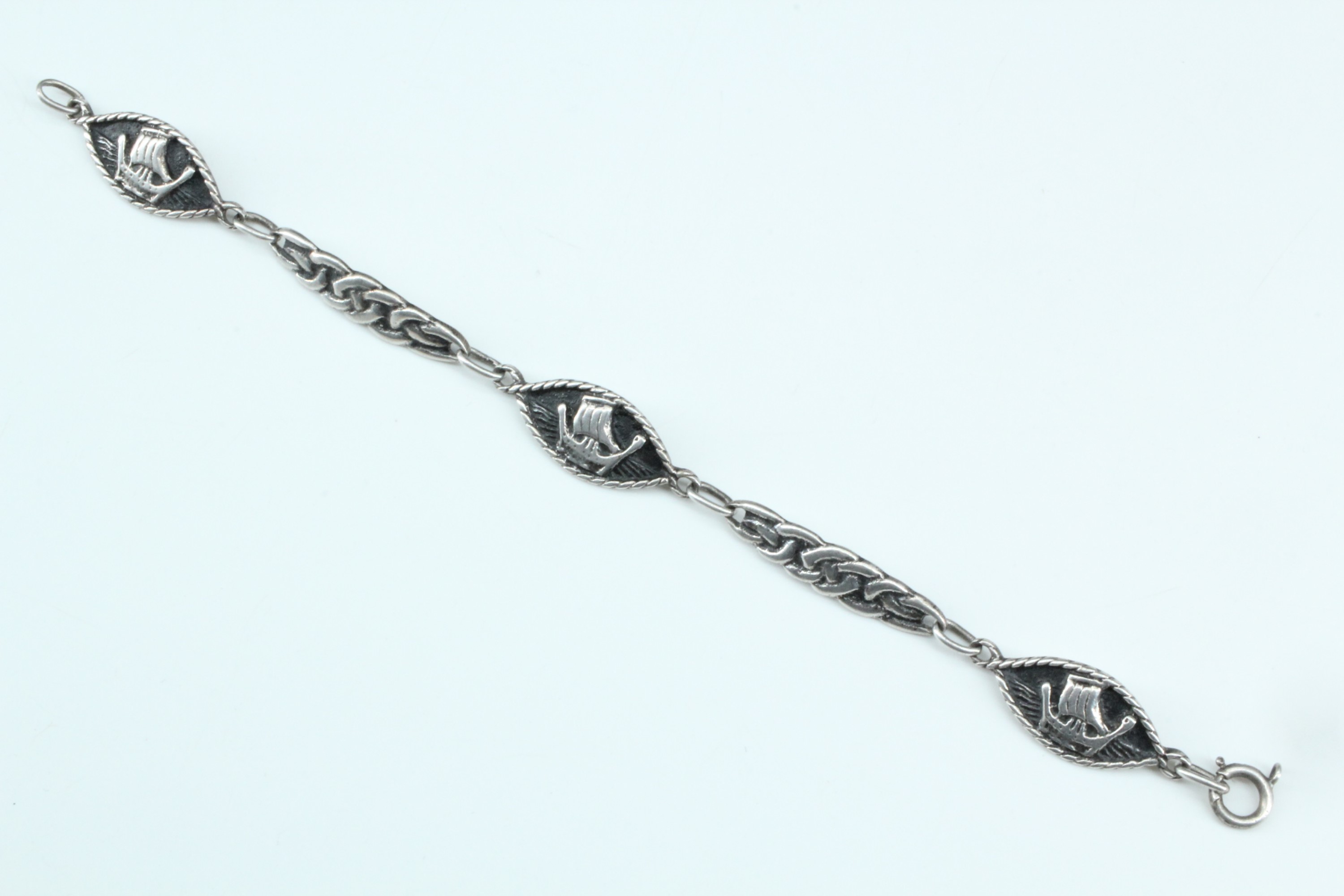 A Scottish Iona white metal bracelet, of Celtic interlace decorated links dividing lenticular - Image 2 of 4