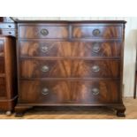 A reproduction mahogany chest of two short over three long drawers, having a sting-inlaid and