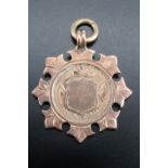 An Edwardian 9 ct gold watch chain fob medallion, 27 mm, 5.8 g