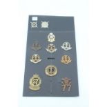 A group of 57th / 77th of Foot and Middlesex Regiment and related cap badges
