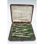 A Victorian cased set of Elkington electroplated nut crackers and grape scissors, complete with