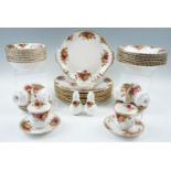 A large quantity of Royal Albert Old Country Rose tea and dinnerware, approx seventy six items ( one