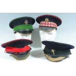 Four post-War Guards peaked dress caps