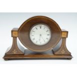 An Edwardian marquetry and string-inlaid mahogany mantle clock, having a French spring-driven
