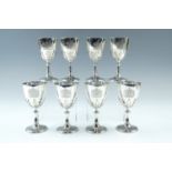 A set of eight Queen's Silver Jubilee commemorative heavy silver goblets, each having a radial-