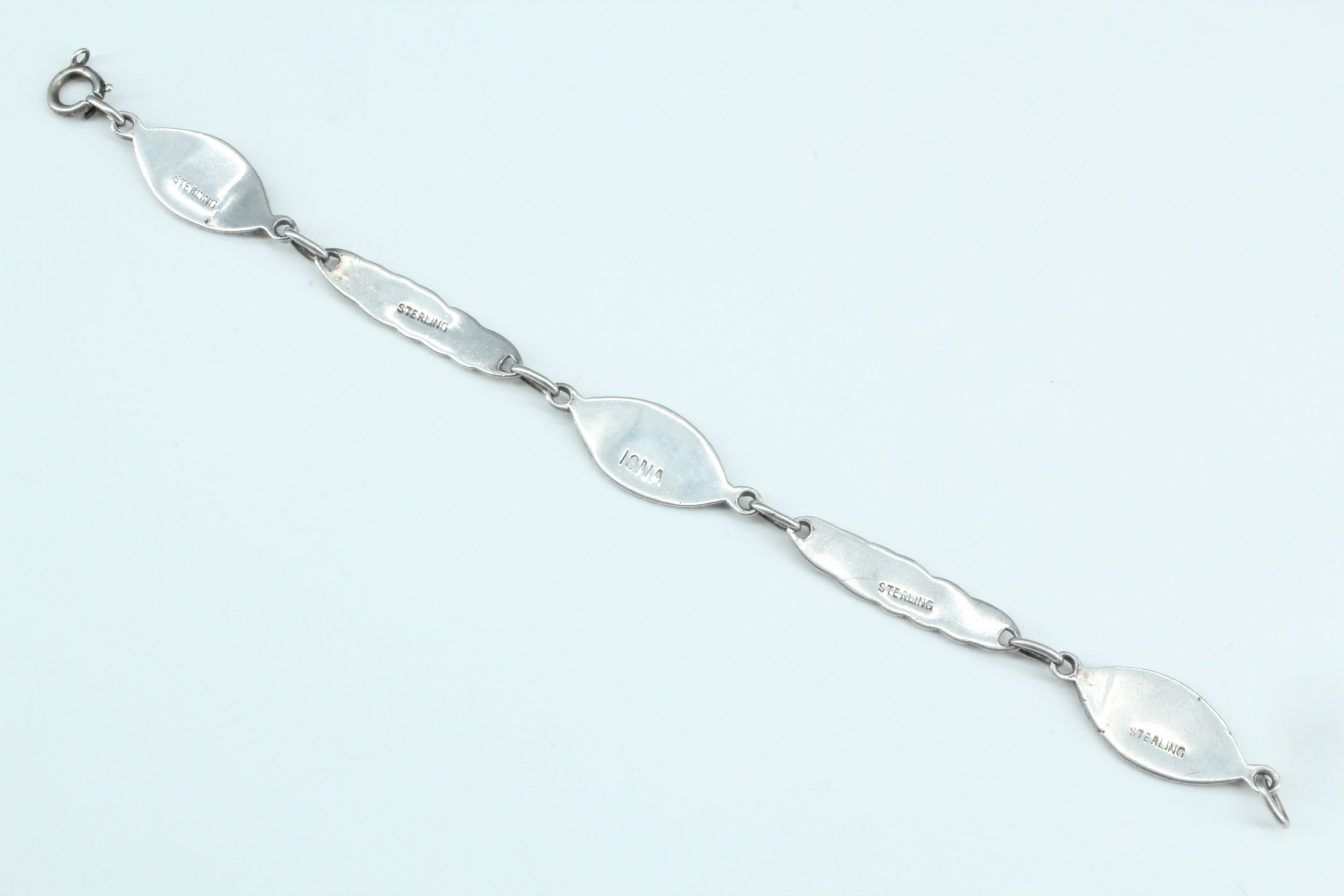 A Scottish Iona white metal bracelet, of Celtic interlace decorated links dividing lenticular - Image 4 of 4