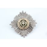 A Scots Guards officer's enamelled white metal forage cap badge by Anderson's, Military