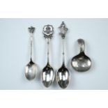 A Georgian style bright cut and wriggle-worked silver caddy spoon, a Glasgow Cathedral and two other