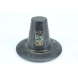 A turned ebony tradition Welsh woman's hat, bearing an applied transfer crest, circa 1920s, 4.5 cm