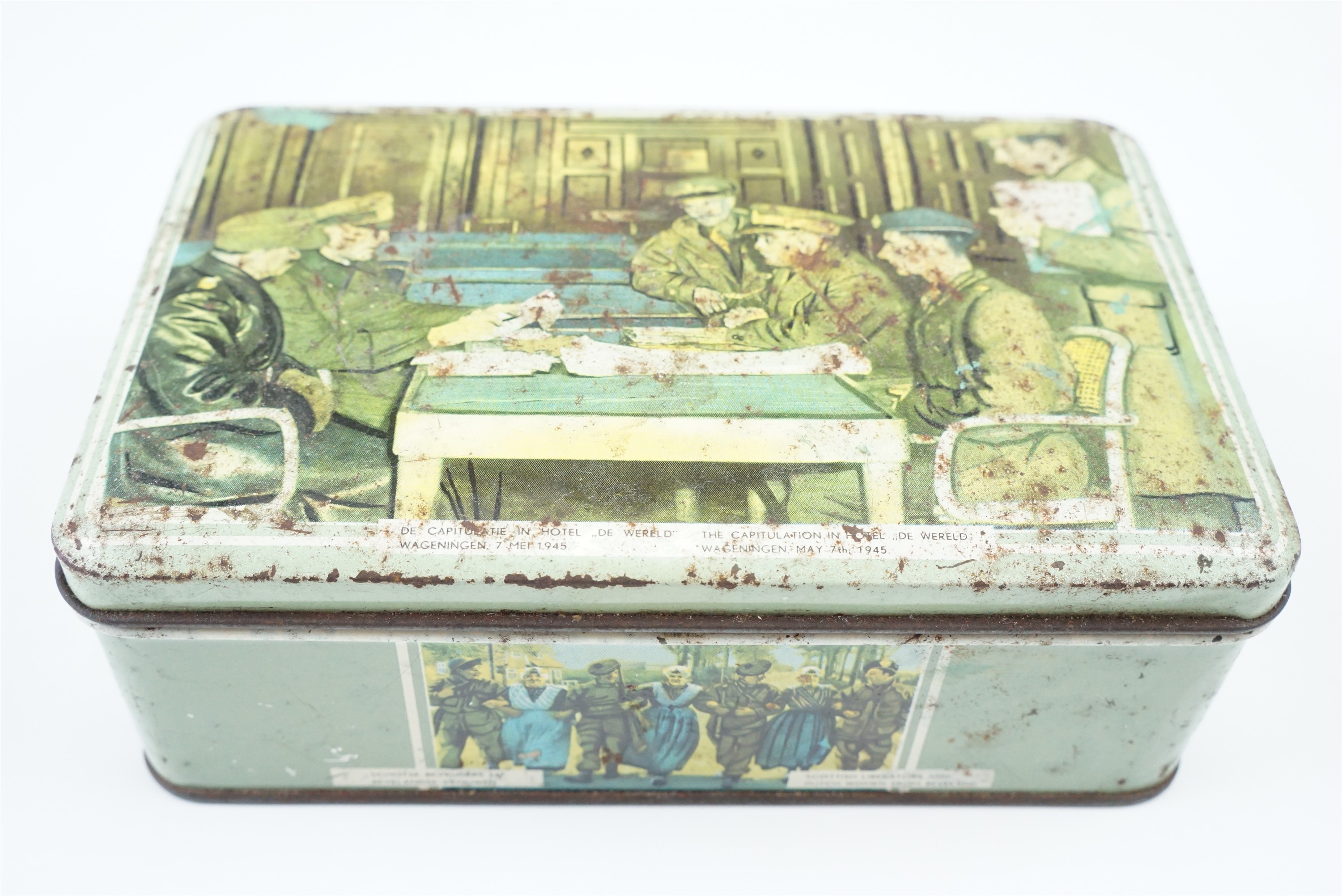 A 1940s Dutch printed tinplate box commemorating the surrender of German forces at Wageningen, May