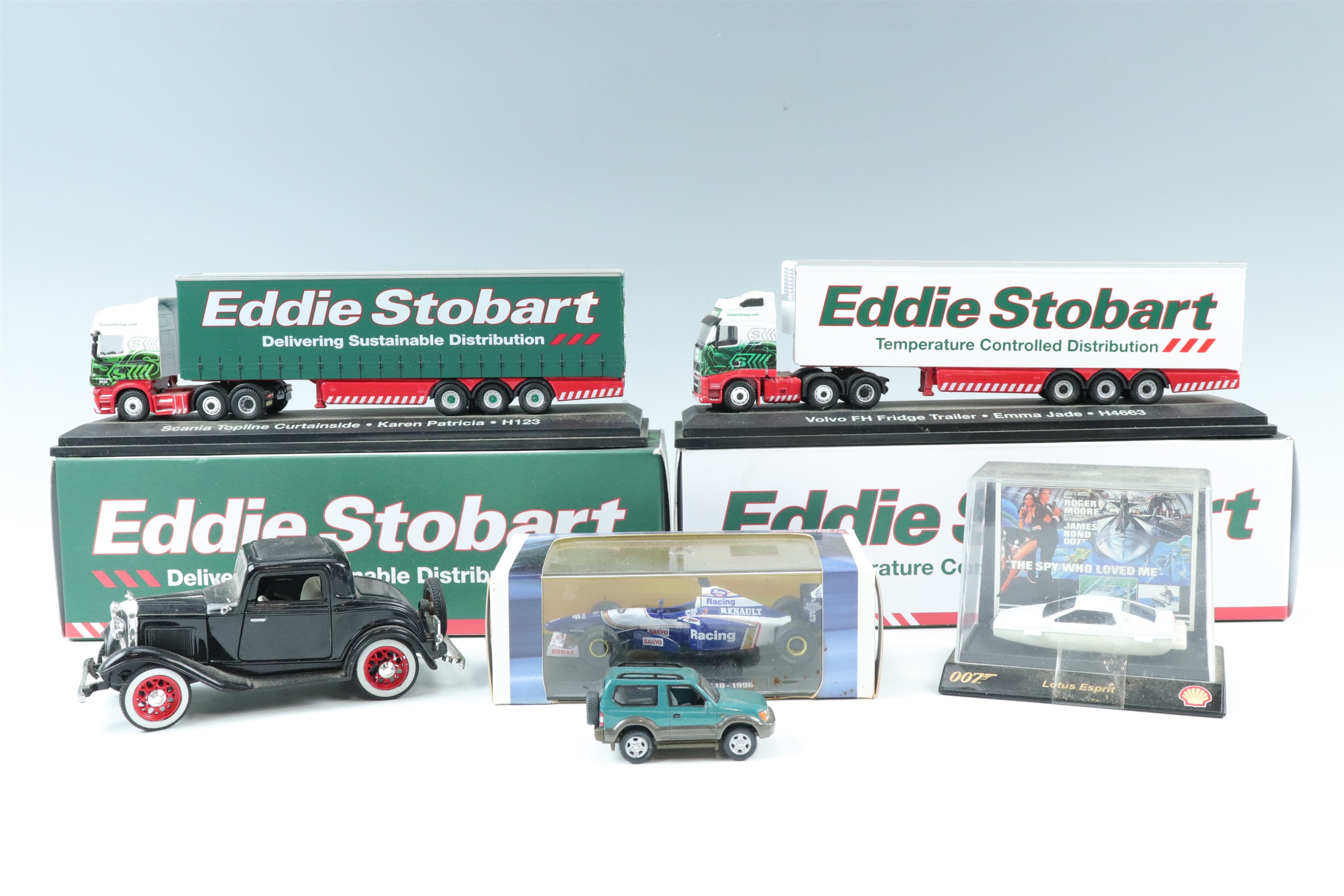 Two boxed Eddie Stobart wagons, a boxed Williams Renault Grand Prix car etc