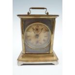 A brass carriage clock with Junghans movement, 18 cm